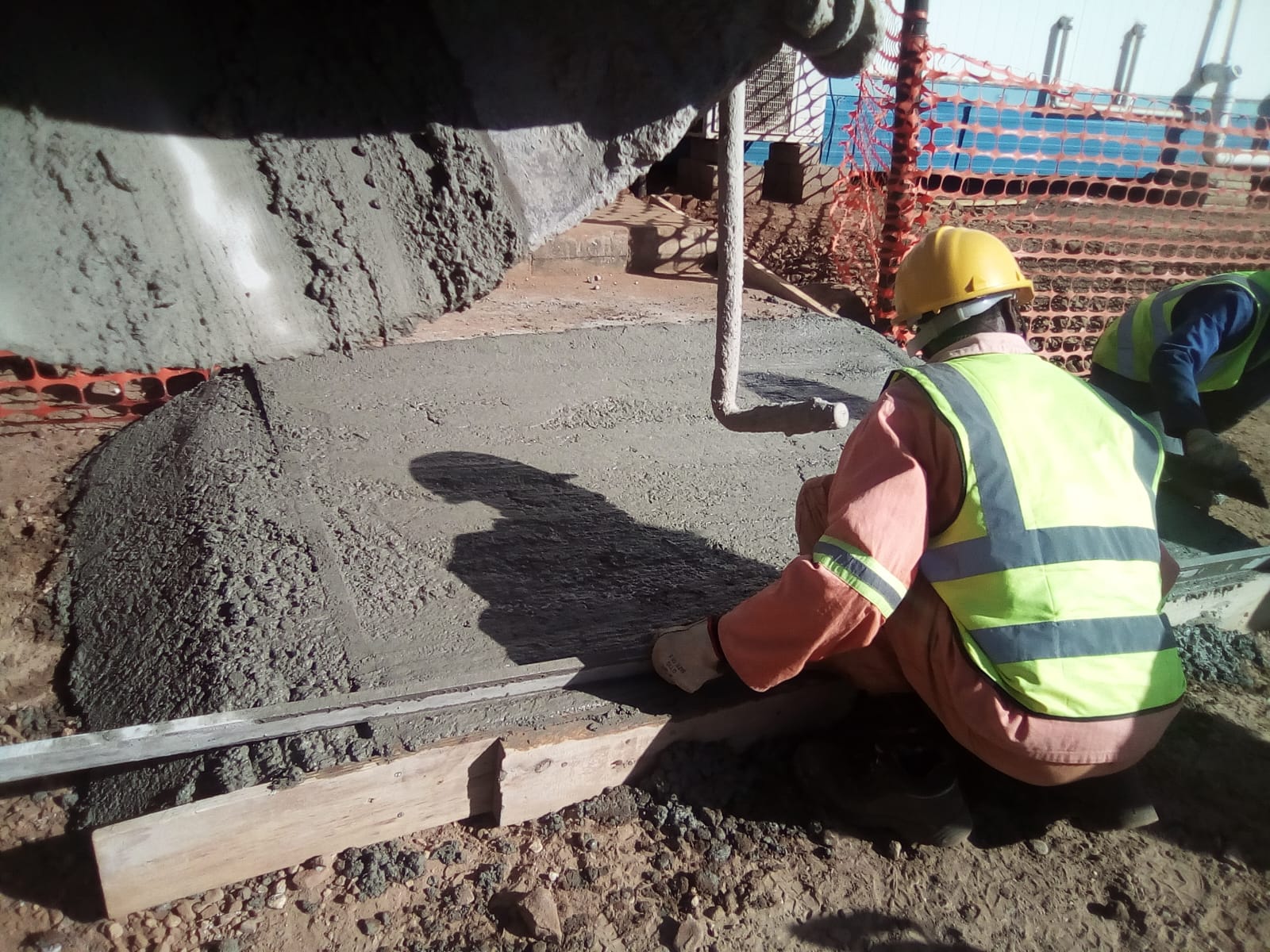 Finishing freshly poured concrete at Zeerust PV Plant